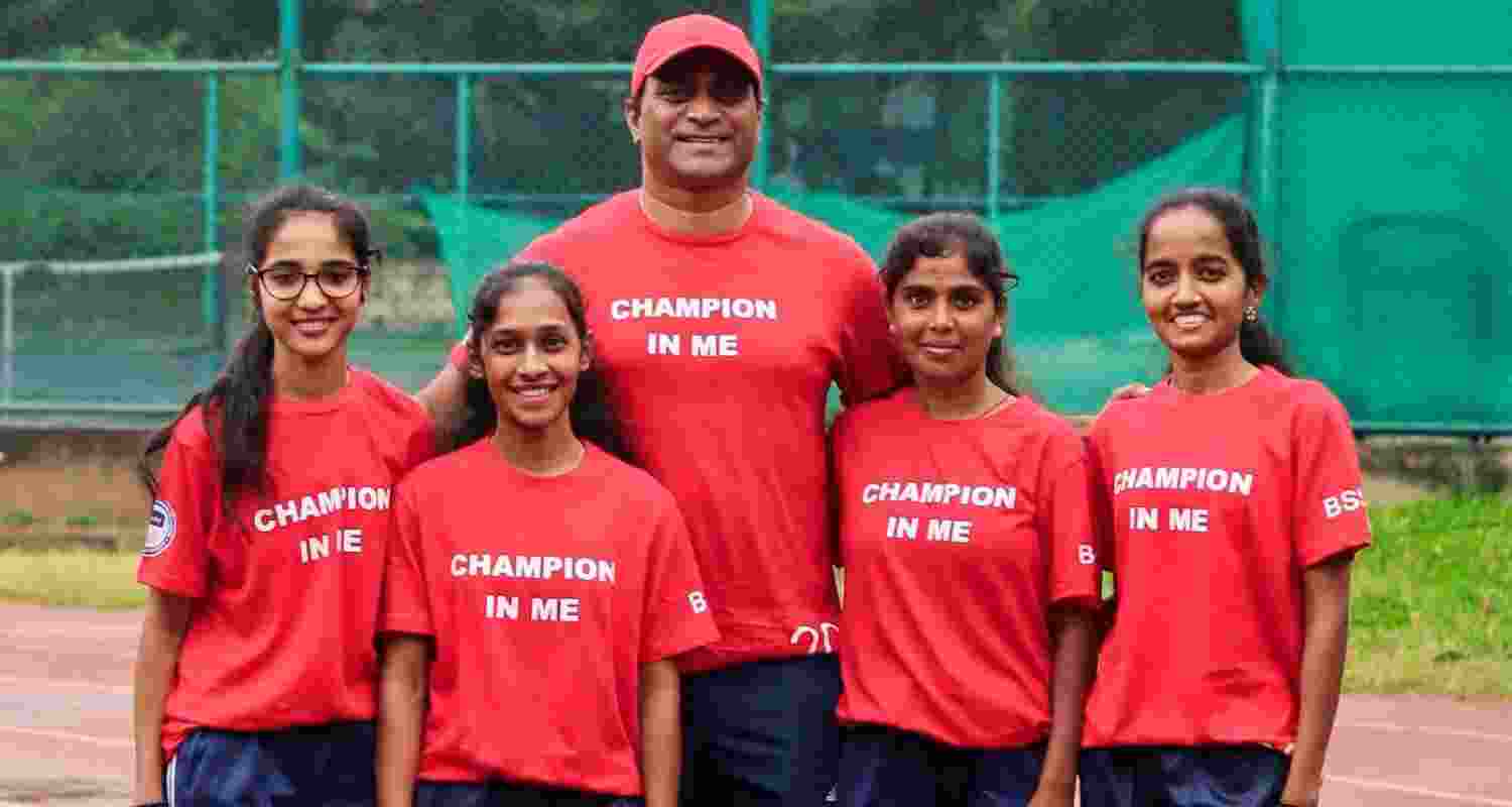 HIV-positive athletes with Elvis Joseph, their mentor.