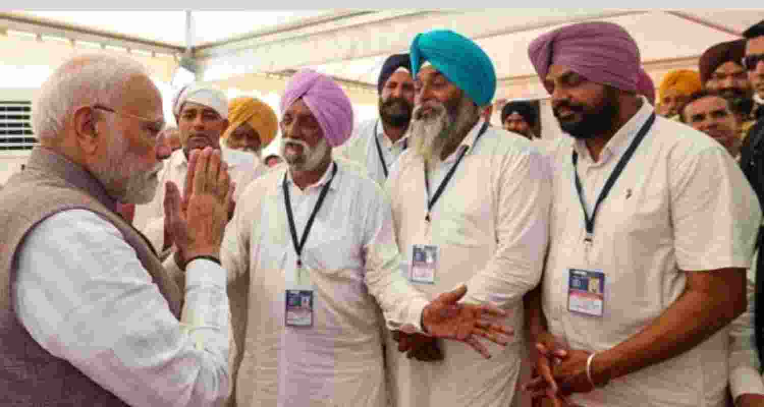 Prime Minister Narendra Modi interacting with flood-affected people in Gurdaspur on Tuesday.