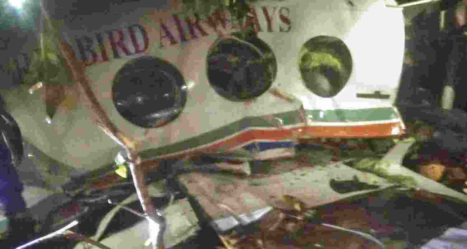Wreckage of an air ambulance, which carried seven people onboard while on its way from Ranchi to Delhi, after it crashed near Simaria, in Chatra district, Jharkhand, Monday. 