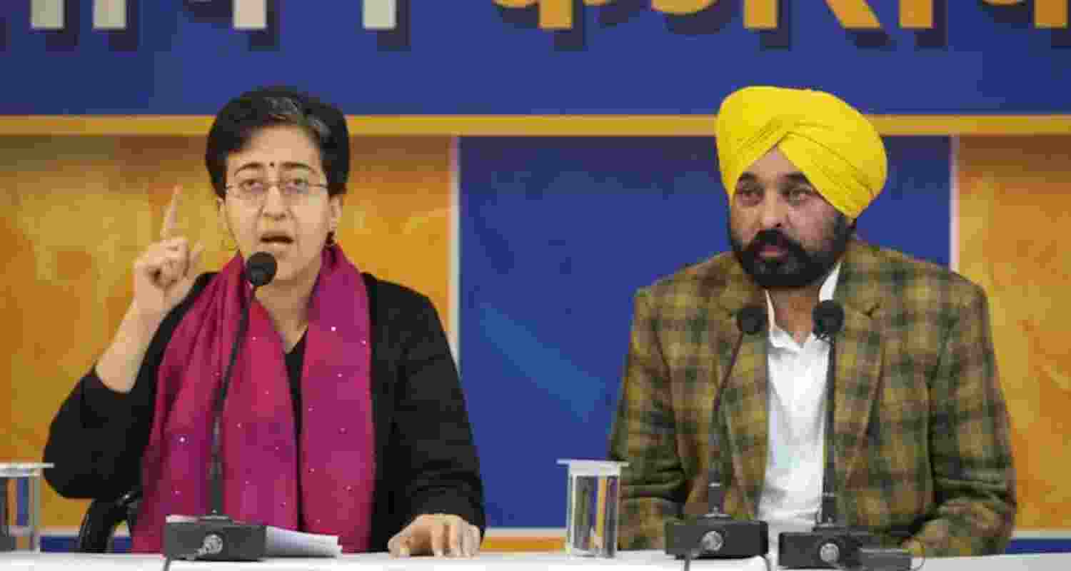 Delhi Chief Minister Atishi and Punjab CM Bhagwant Mann addressing a press conference by AAP in New Delhi on Friday.
