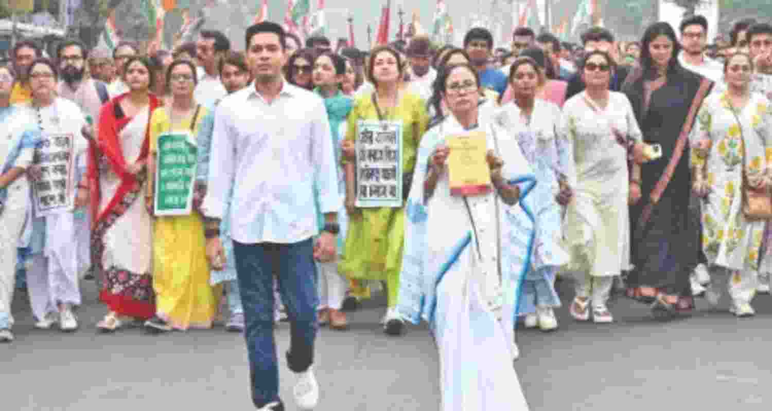 TMC leaders Mamata Banerjee and Abhishek Banerjee lead a protest march - file image.