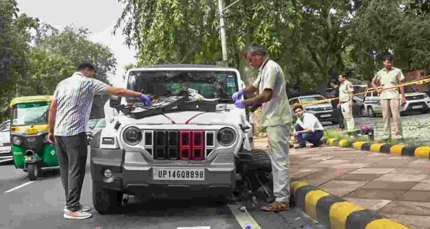 Police personnel and forensic experts at the site after a speeding white Thar kills one person, injures another at Mother Teresa Road, in New Delhi. Police personnel and forensic experts at the site after a speeding white Thar kills one person, injures another at Mother Teresa Road, in New Delhi.