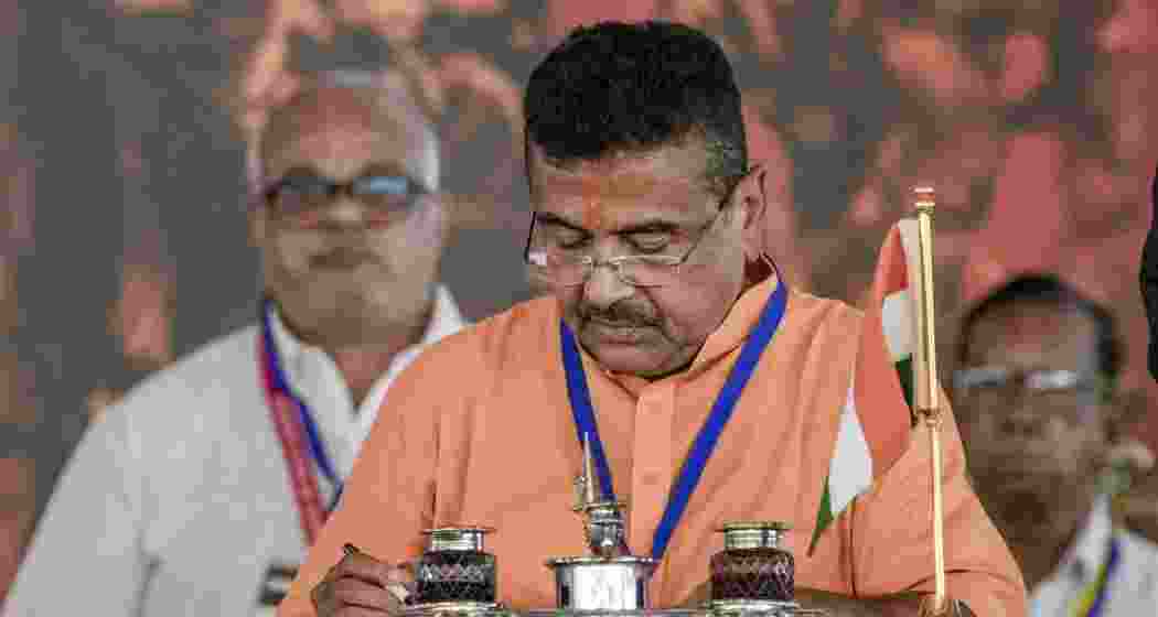 West Bengal chief minister-elect Suvendu Adhikari signs documents during his swearing-in ceremony as BJP forms government in the state for the first time, at Brigade Parade Ground in Kolkata, West Bengal, on Saturday.