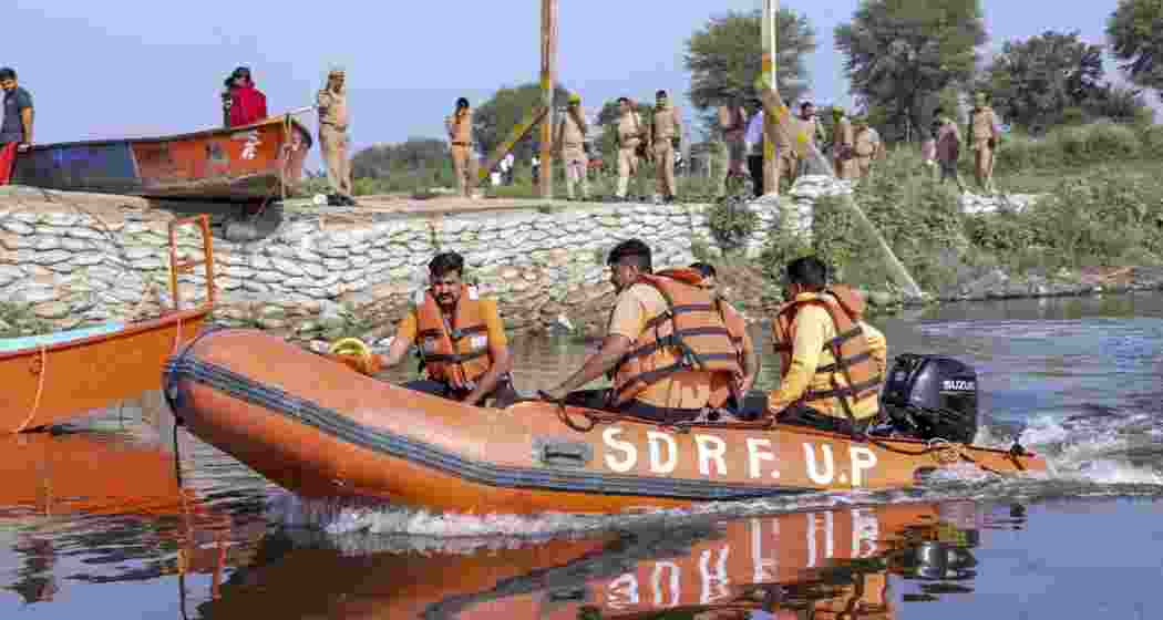 SDRF personnel during a search operation in the Yamuna river after a boat carrying pilgrims capsized on Friday, near Kesi Ghat, in Mathura district, on Saturday.