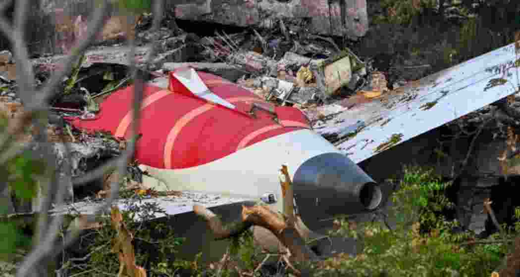 The shattered tail section of AI 171 lies amid debris at a medical college in Ahmedabad. Experts now suspect dual engine failure triggered the crash moments after takeoff.