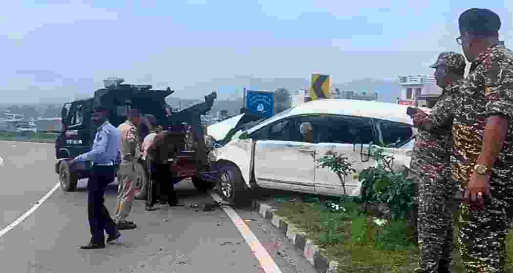 Security personnel inspect the damaged Innova carrying Amarnath pilgrims after it was hit by a truck near Battal Ballian in Udhampur district on Friday morning.