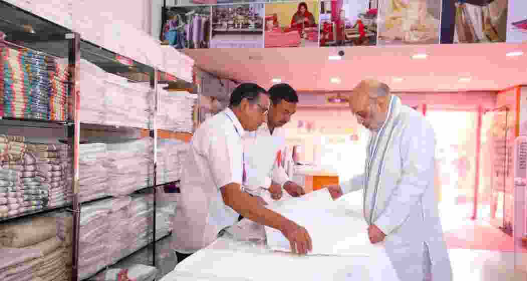 Amit Shah interacts with artisans at the Khadi Karigar Mahotsav in Rohtak on Friday. 
