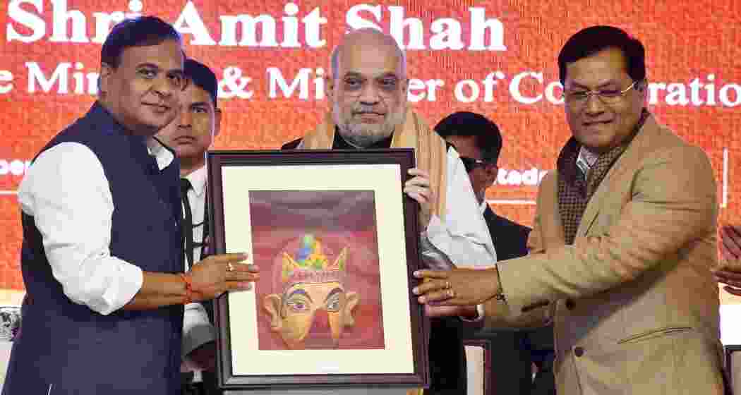 Union Home Minister Amit Shah being felicitated by Union Minister of Minister of Ports Sarbananda Sonowal and Assam Chief Minister Himanta Biswa Sarma during the inauguration of Batadrava Than, the birthplace of Vaishnavite saint Srimanta Sankardeva, in Nagaon on Monday.
