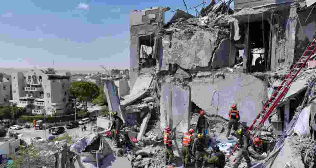 Emergency personnel working at a residential site, following a missile attack from Iran on Israel, in Beersheba, Israel.