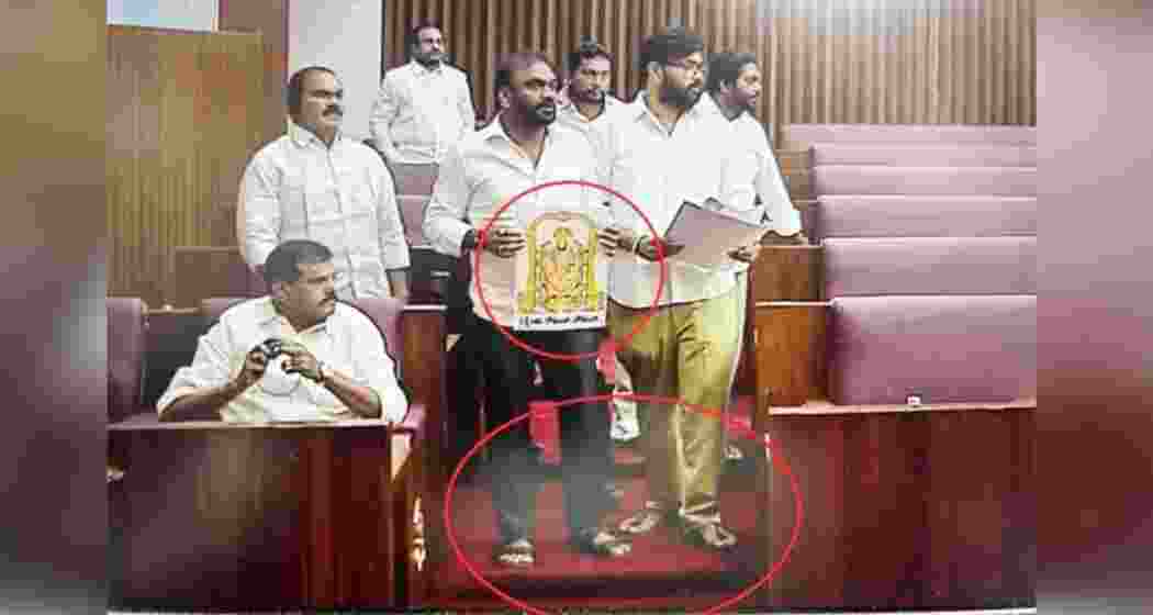 Members of the Andhra Pradesh Legislative Council raise slogans during a heated session in Vijayawada after ruling coalition legislators accused the opposition of ‘blasphemy’, leading to chaotic scenes and adjournment of the House.