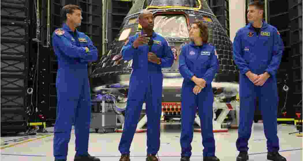 The Artemis 2 astronauts with their Orion spacecraft.