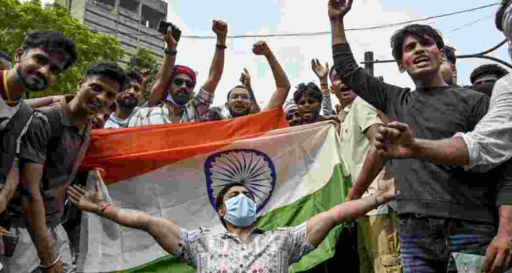 Students celebrating at Jantar Mantar after the government gave in to their demand for the Union Education Minister's resignation.