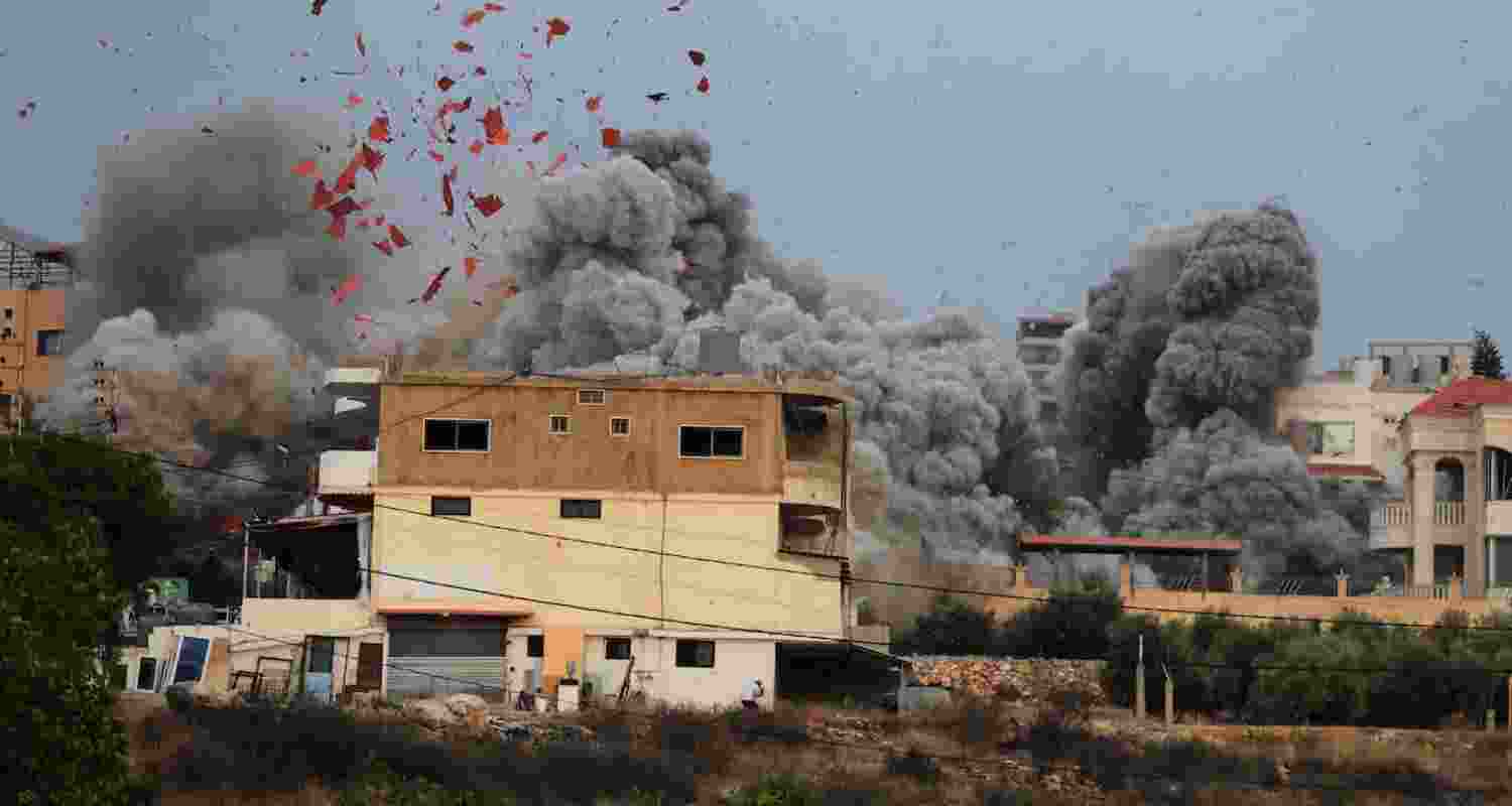A file photograph of smoke and debris rising after an Israeli airstrike on the southern Lebanese village of Teir Debba.
