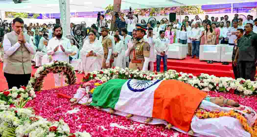 Maharashtra Chief Minister Devendra Fadnavis lays a wreath on the mortal remains of legendary playback singer late Asha Bhosle, at Shivaji Park in Mumbai on Monday. State Deputy Chief Ministers Eknath Shinde and Sunetra Pawar also present.