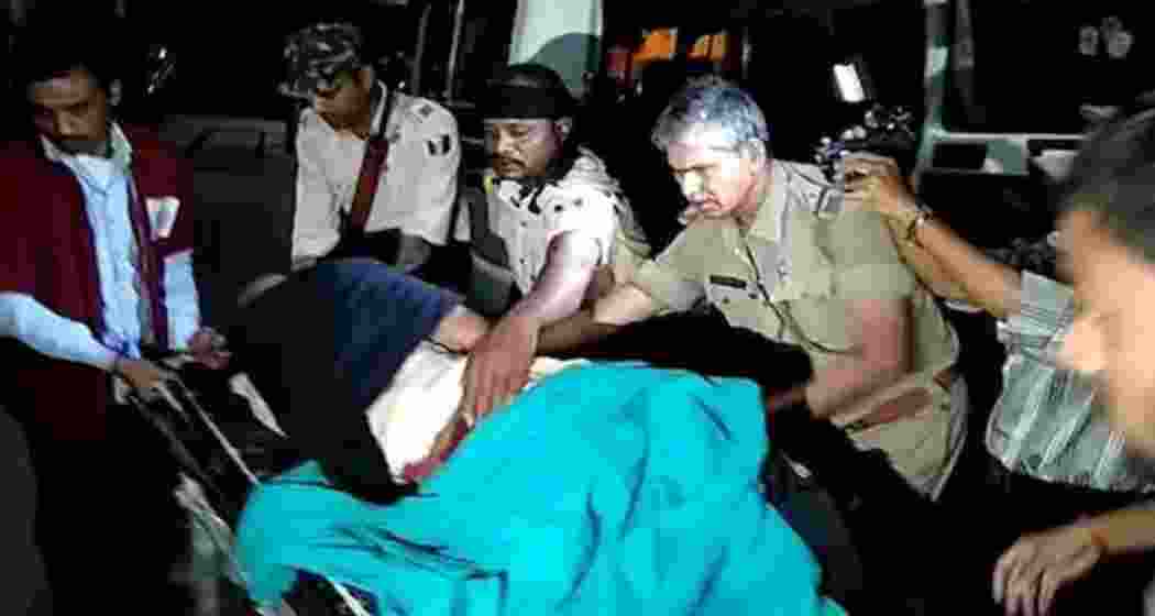 ASI Rajiv Ranjan being rushed to the hospital after collapsing during a clash between police and villagers in Laxmipur, Araria. He was later declared dead by doctors. 