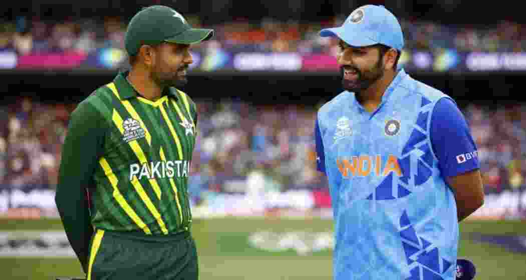 Former captains Rohit Sharma and Babar Azam, who led India and Pakistan, respectively, in the Asia Cup, during a pre-match exchange.