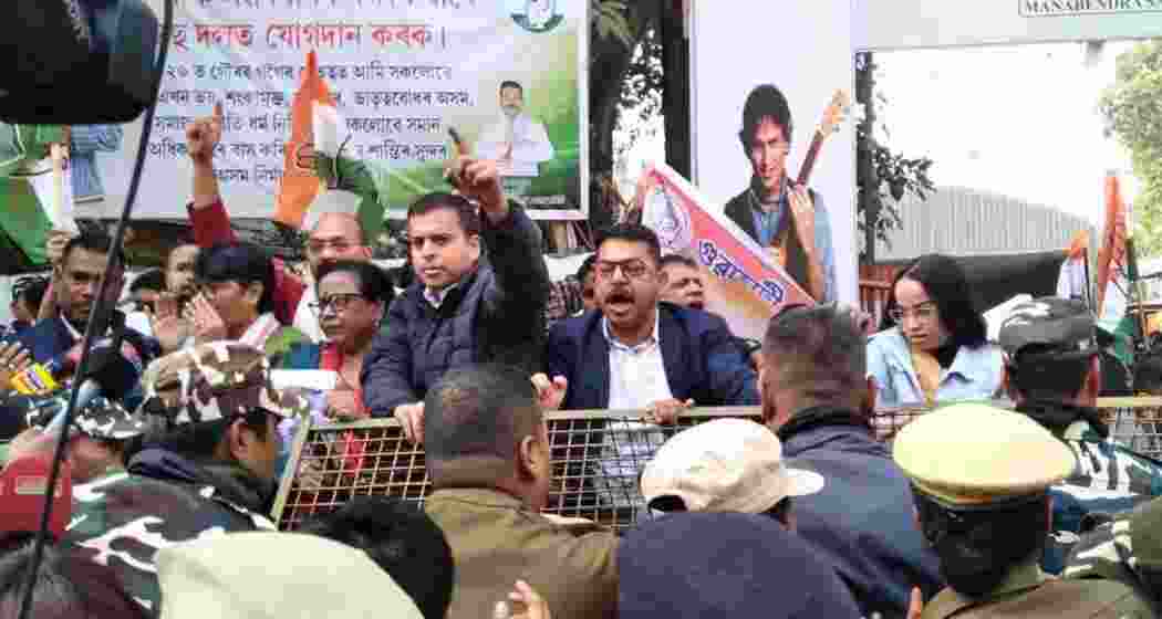 Congress workers protest outside the Manabendra Sharma Complex in Dispur, on Tuesday. 