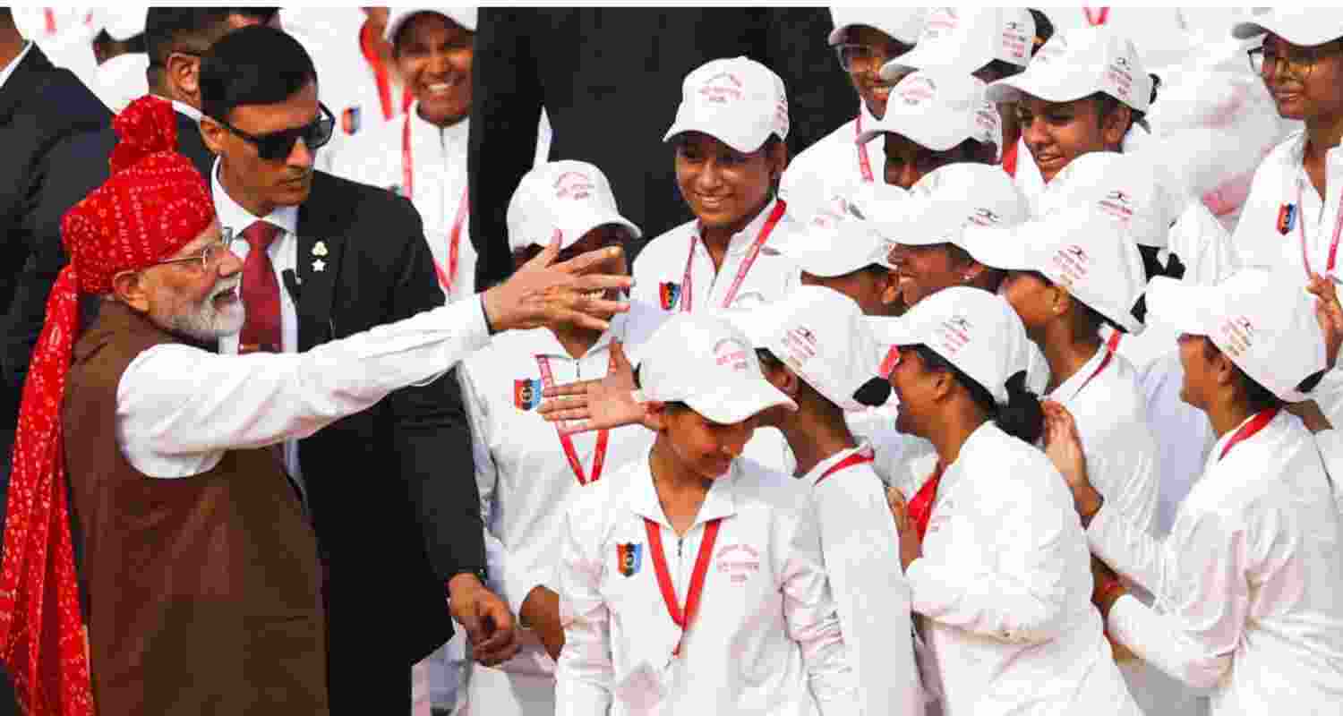 Prime Minister Narendra Modi interacting with school students during the Independence Day celebrations in New Delhi on Saturday.
