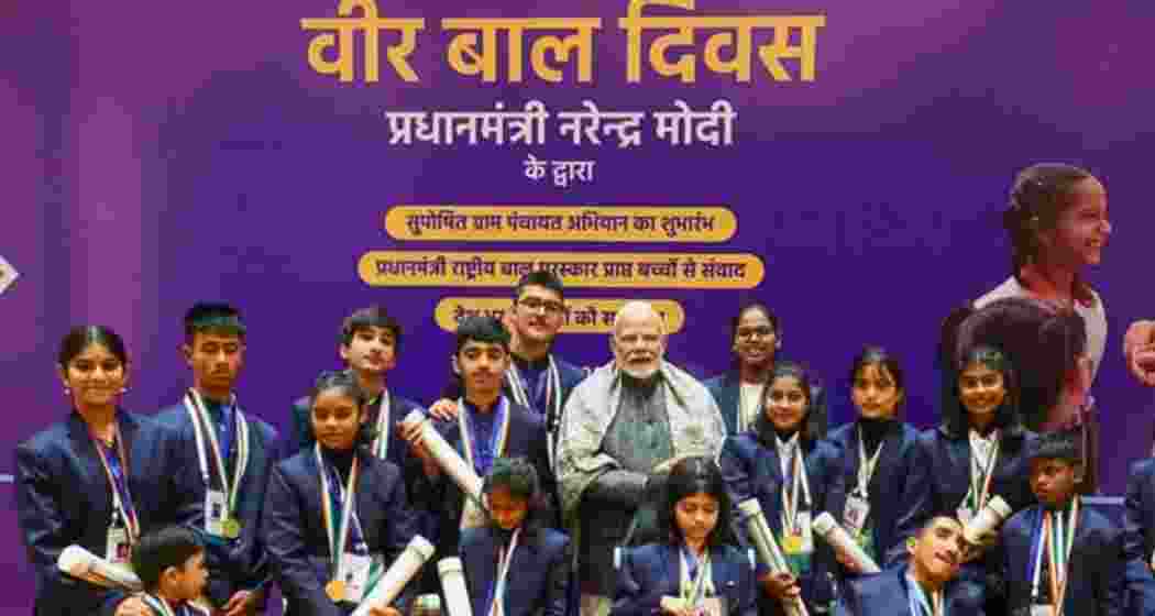 Prime Minister Narendra Modi poses with children during a Pradhan Mantri Rashtriya Bal Puraskar function in New Delhi.