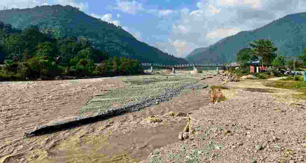 A furious Balason river rushes beneath the damaged Iron Bridge at Dudhiya in Darjeeling district, West Bengal, after heavy rains swept away homes and families along its banks.