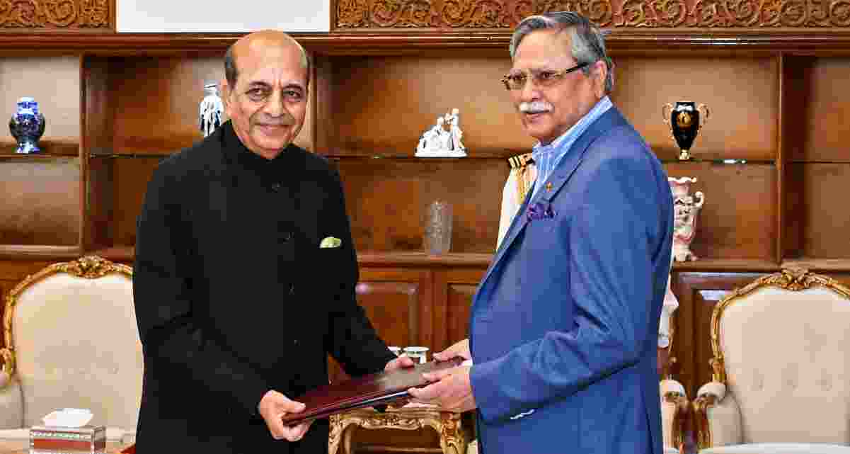 Indian High Commissioner Dinesh Trivedi presents a memorandum of understanding (MoU) related to visa facilitation to Bangladesh President Mohammed Shahabuddin during a ceremony at Bangabhaban in Dhaka.