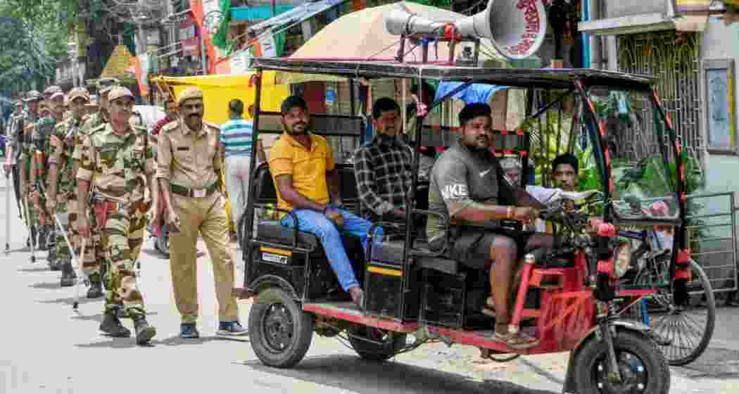 Security personnel patrol on the eve of counting and results of the West Bengal Assembly polls, in Howrah, West Bengal, on Sunday.