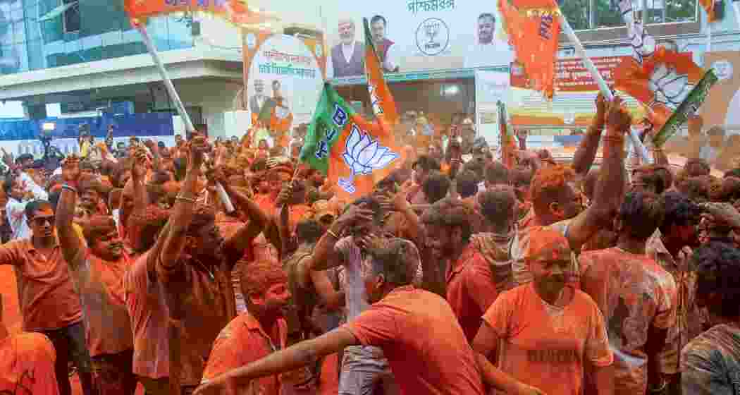  BJP supporters apply 'gulal' amid celebrations during vote tabulation on the day of West Bengal Assembly election results, in Kolkata, Monday, May 4, 2026. 