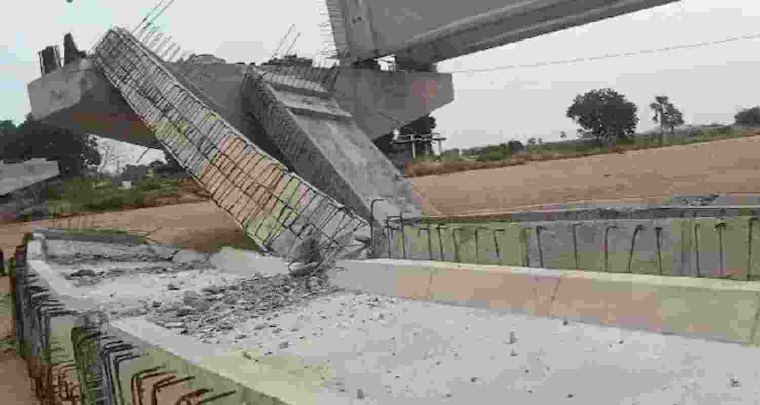 Two concrete girders, from a set of five bridging two pillars 100 feet apart, collapsed at 9:45 pm due to strong winds, raising stability concerns for the rest. 