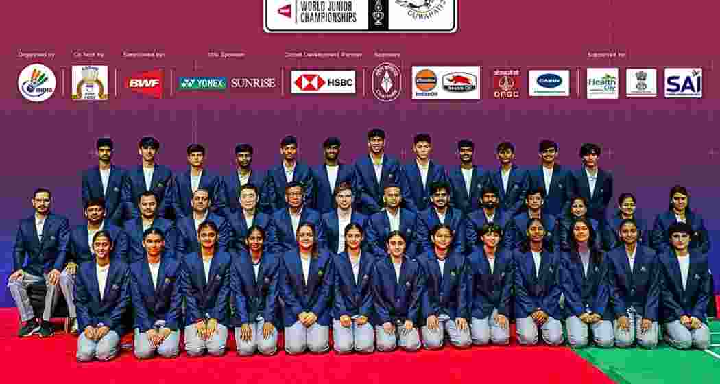 Indian shuttlers, along with officials and team  nembers, pose for a photograph. 