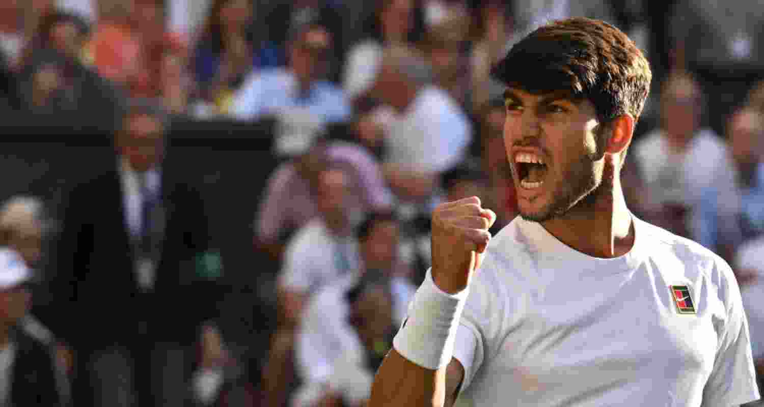 Carlos Alcaraz celebrates after winning his quarterfinal match against Cameron Norrie.