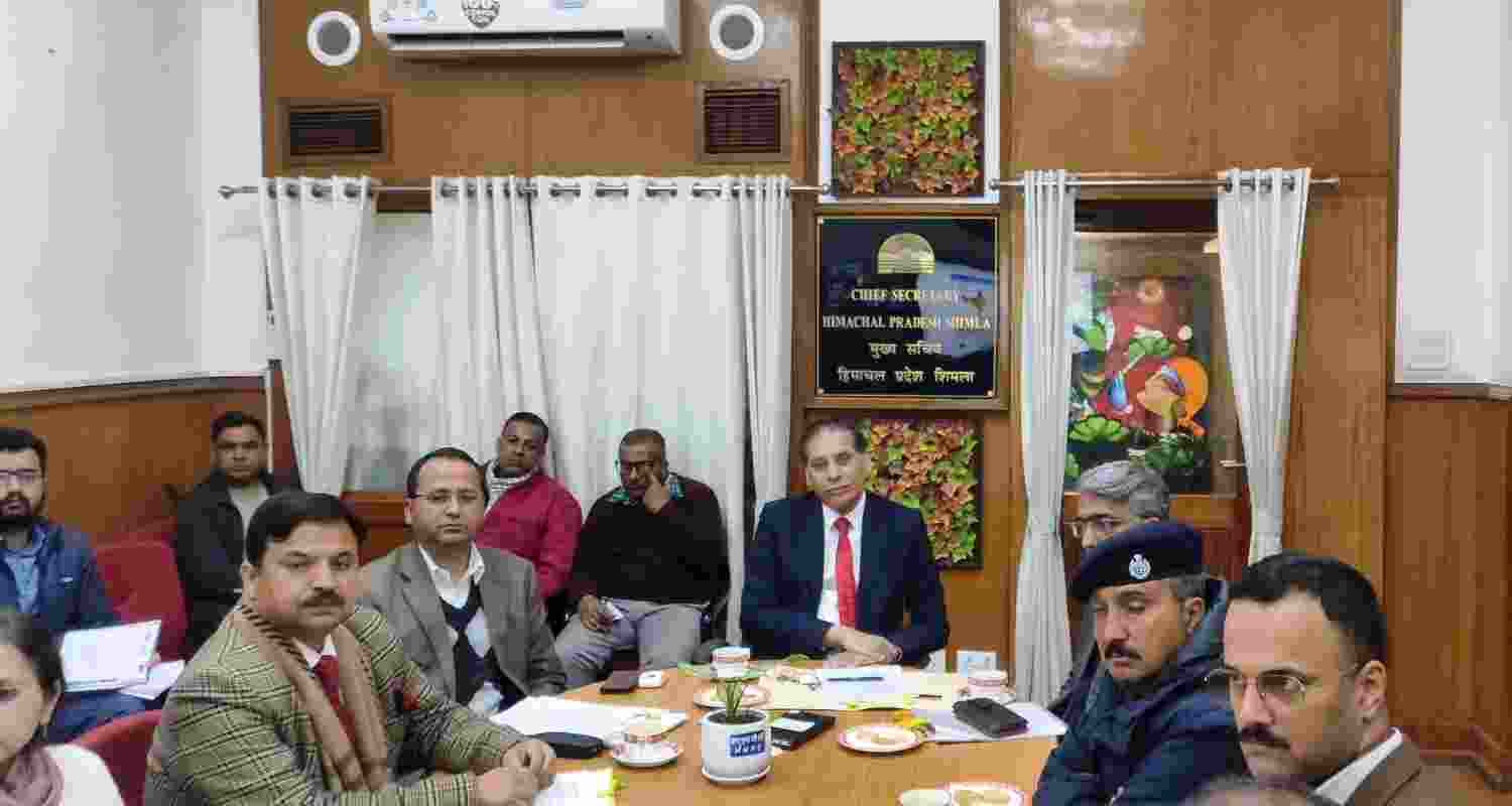 Himachal Pradesh Chief Secretary Prabodh Saxena with officers in Shimla,Tuesday.