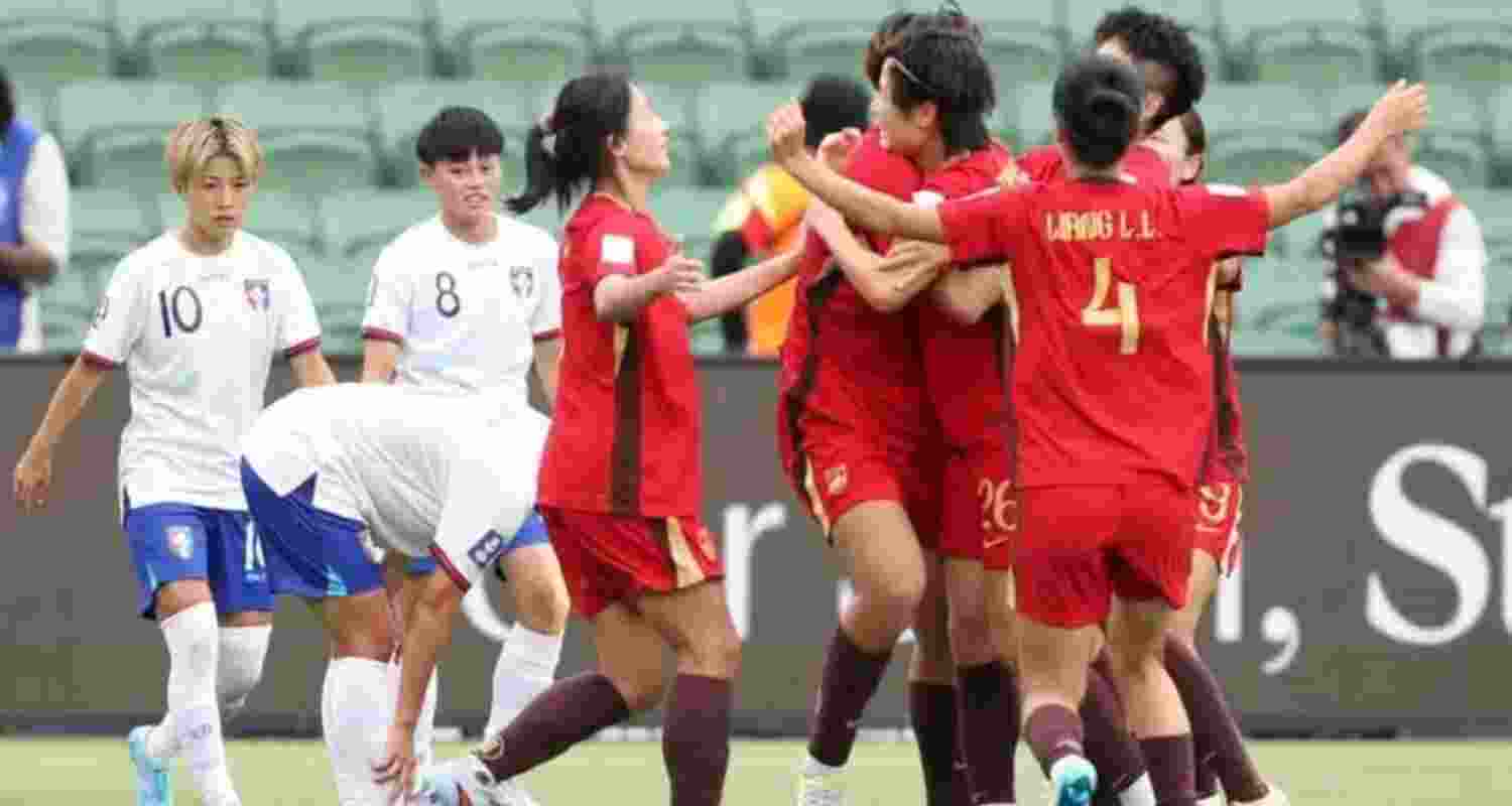 China's women footballers celebrating their win over Taiwan. 