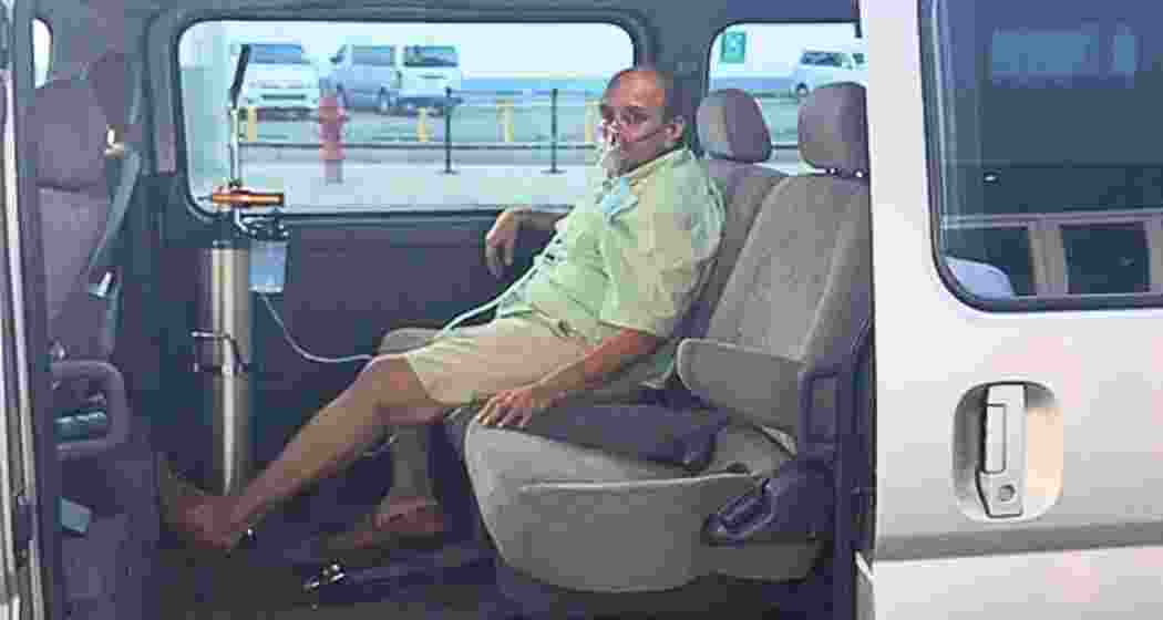 Fugitive businessman Mehul Choksi seen receiving oxygen support inside a vehicle, reportedly after a health scare during his legal proceedings abroad.