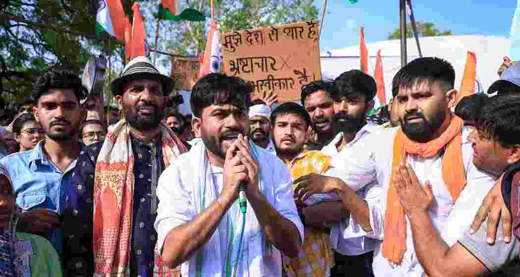 CJP leader Abhijeet Dipke along with party supporters stage a protest against Union Education Minister Dharmendra Pradhan over the alleged NEET-2026 examination paper leak, at Shaheed Smarak, in Jaipur, Rajasthan, Monday.