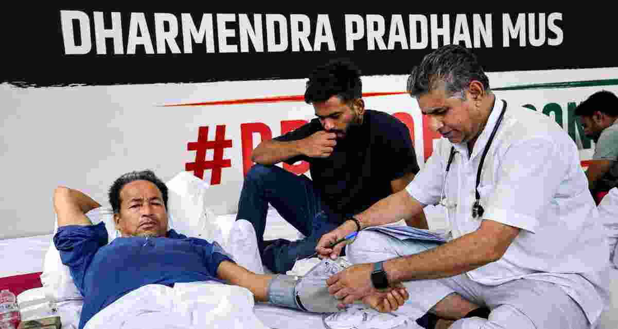 Climate activist and educationist Sonam Wangchuk being attended by a medical professional as Cockroach Janata Party (CJP) founder Abhijeet Dipke looks on during a hunger strike by CJP demanding action over alleged irregularities in examinations and seeking the resignation of Union Education Minister Dharmendra Pradhan, at Jantar Mantar, in New Delhi on Saturday. Wangchuk is on the seventh day of his indefinite hunger strike in support of the youth-led protest.
