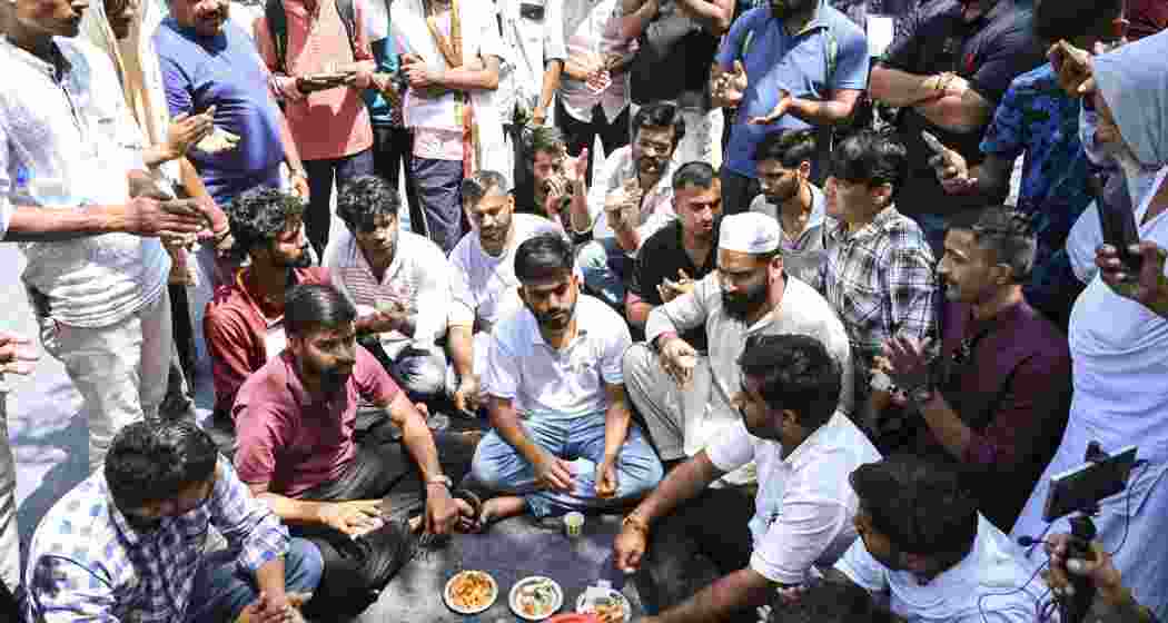 Cockroach Janta Party (CJP) founder Abhijeet Dipke, front centre, with supporters on the third day of a protest over alleged examination irregularities, repeated paper leaks and demands for accountability from the government, in New Delhi, on Monday.