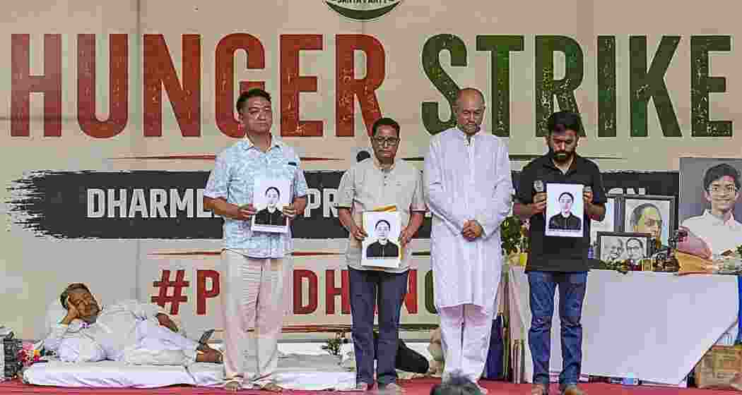 CJP founder Abhijeet Dipke with parent of a 23-year-old NEET aspirant who allegedly died by suicide in Dehradun, during the protest at Jantar Mantar, on Sunday. (Photo:PTI) 