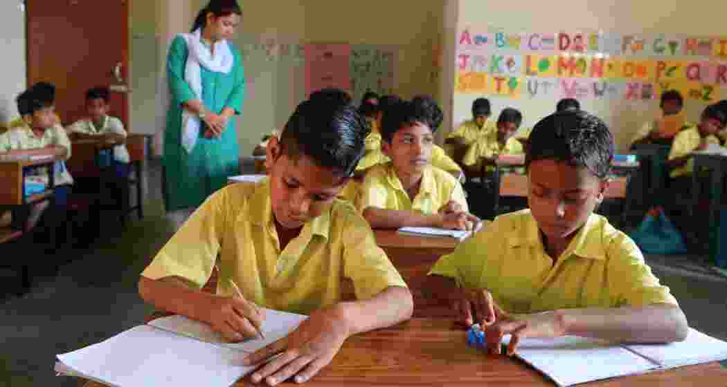Students attend class at a single-teacher school in India.