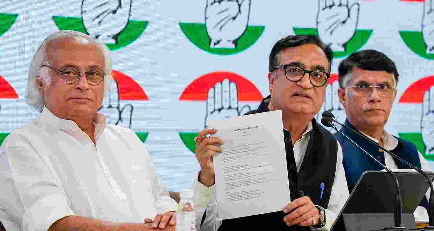 Congress leaders Jairam Ramesh and Ajay Maken during a press conference, in New Delhi, Friday.