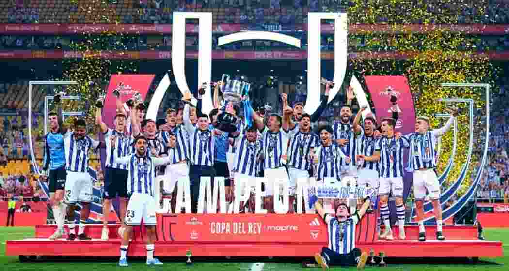 Real Sociedad players celebrate after winning the Copa del Rey following a penalty shootout against Atletico Madrid in Seville. 
