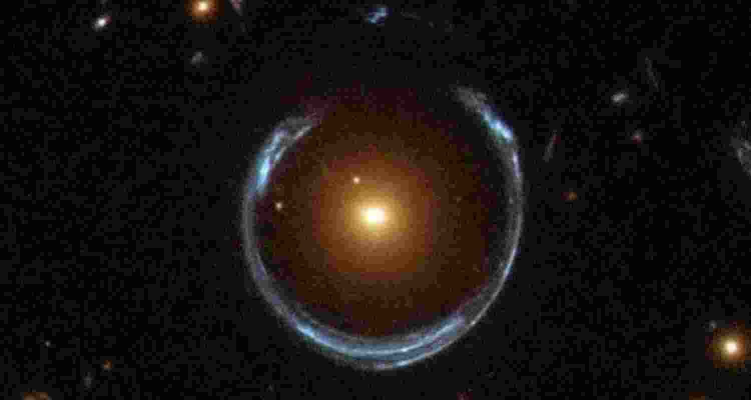LRG 3-757, or the Cosmic Horseshoe, where the yellow galaxy has magnified the light of the blue one farther away.
