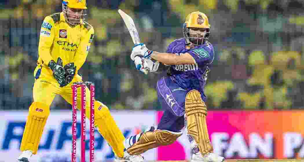 Rinku Singh plays a shot as MS Dhoni keeps wicket from behind during CSK’s match against KKR at Chepauk on Friday.