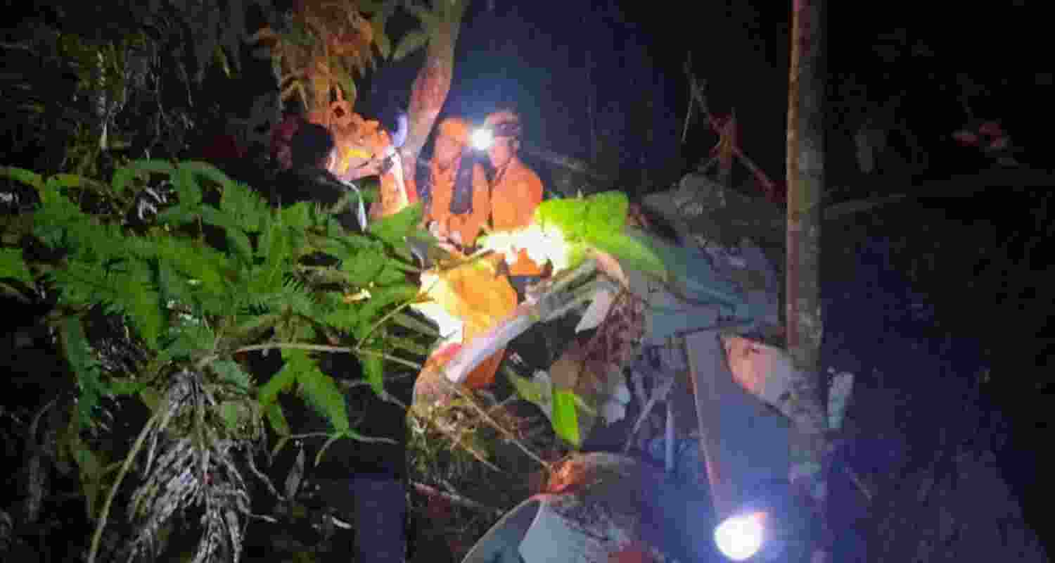 A search team after locating the wreckage of the helicopter in a forest in Sekadau district in Borneo island.
