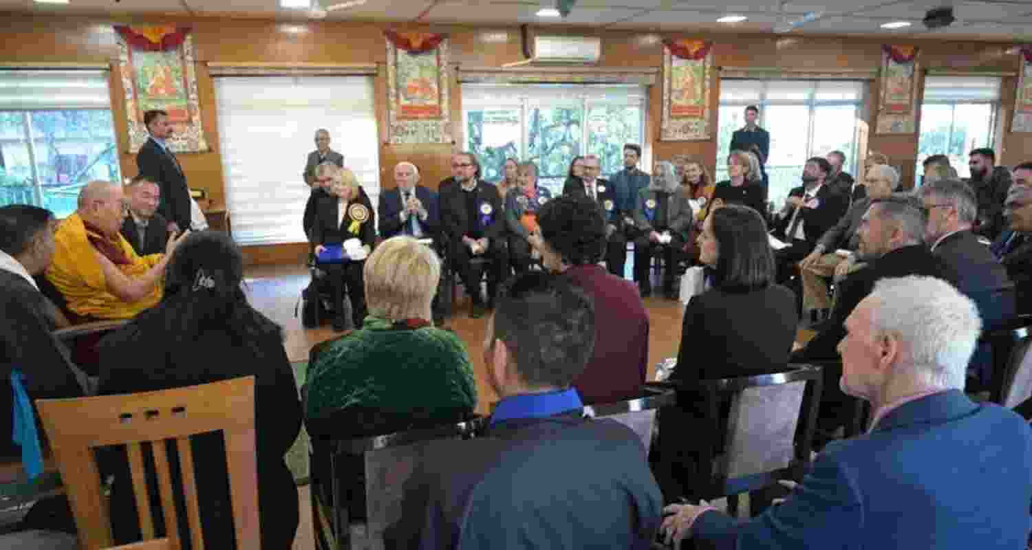 Dalai Lama interacts with foreign delegates.