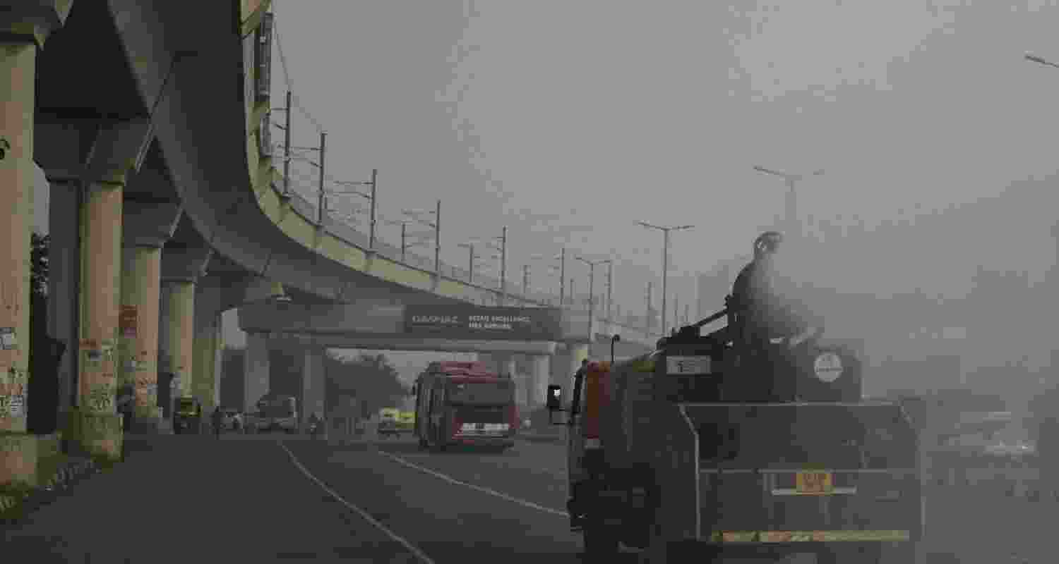 A view of an anti smog gun spraying water to settle down dust.