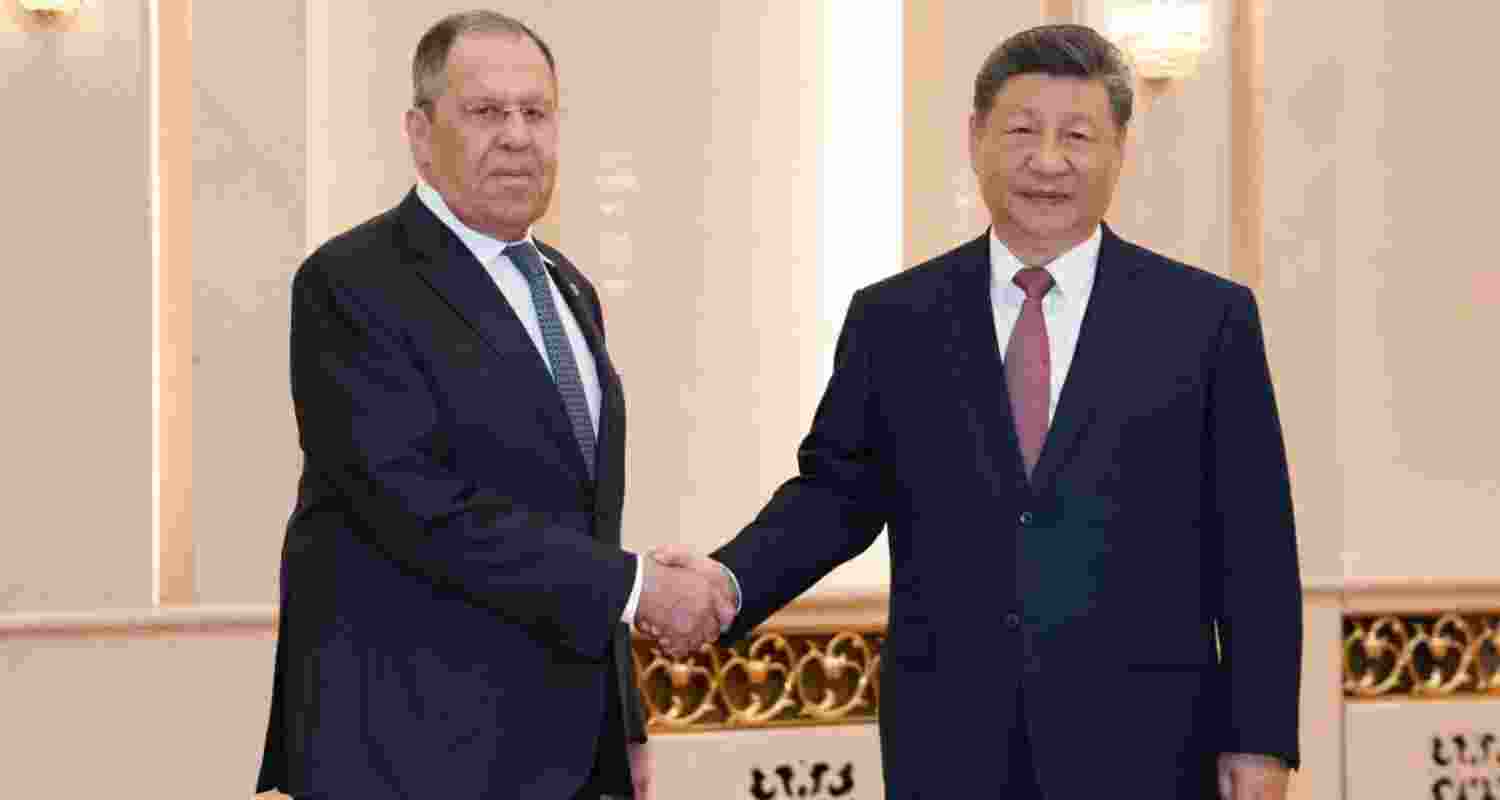 Russia's Foreign Minister Sergei Lavrov (left) shaking hands with China's President Xi Jinping in Beijing on Wednesday.