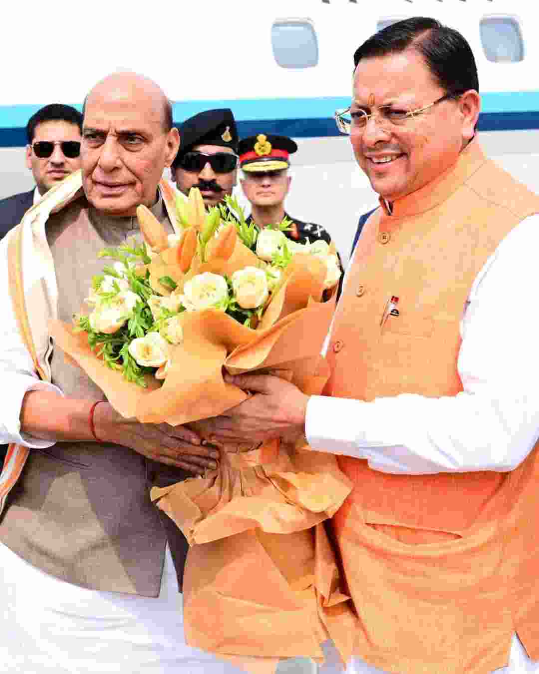 Uttarakhand Chief Minister Pushkar Singh Dhami greets Defence Minister Rajnath Singh in Dehradun on Monday.