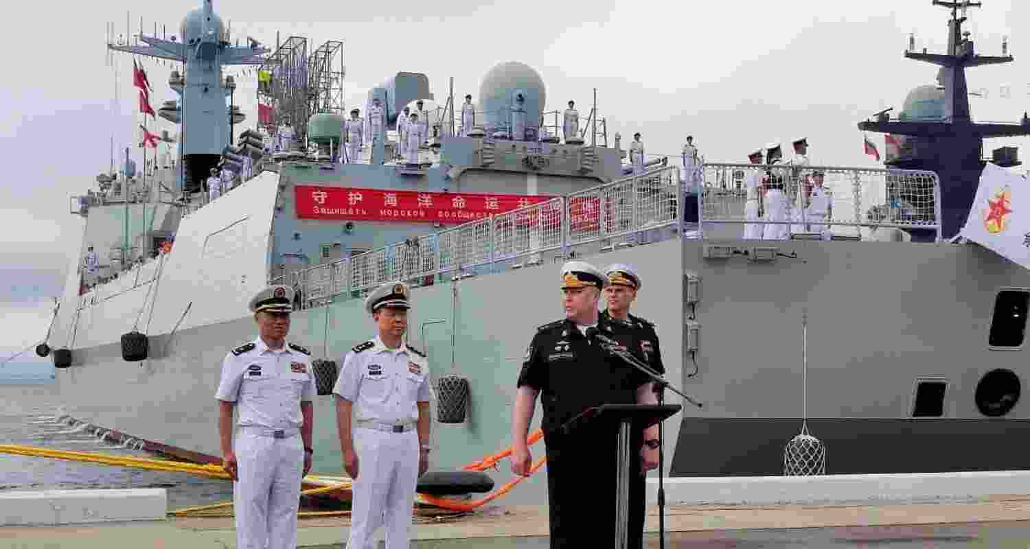 Russian and Chinese naval officers take part in a ceremony marking the start of the upcoming joint naval drills in the Sea of Japan, following the arrival of Chinese military vessels in Vladivostok, Russia.