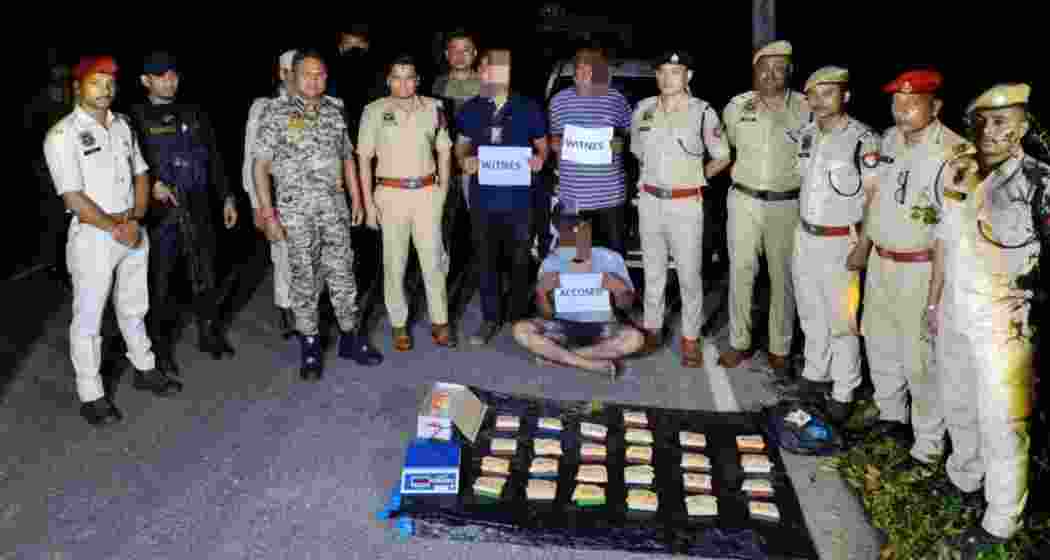 Assam Rifles personnel display heroin recovered during a joint operation in Cachar district, Assam. 