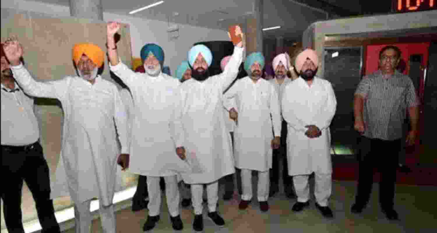 Congress MLAs led by Leader of Opposition Partap Singh Bajwa staging a walkout from the Punjab Assembly on Friday.
